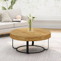 Table basse ronde naturelle et noire, plateau en bois sculpté, piètement en métal à 6 pieds
