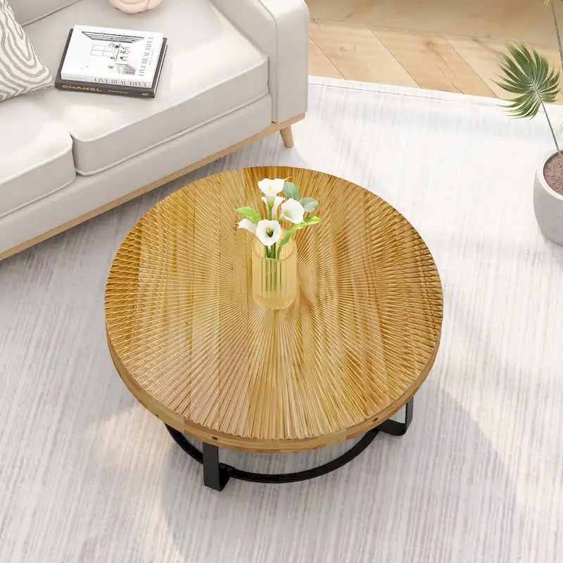 Table basse ronde naturelle et noire, plateau en bois sculpté, piètement en métal à 6 pieds