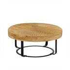 Table basse ronde naturelle et noire, plateau en bois sculpté, piètement en métal à 6 pieds